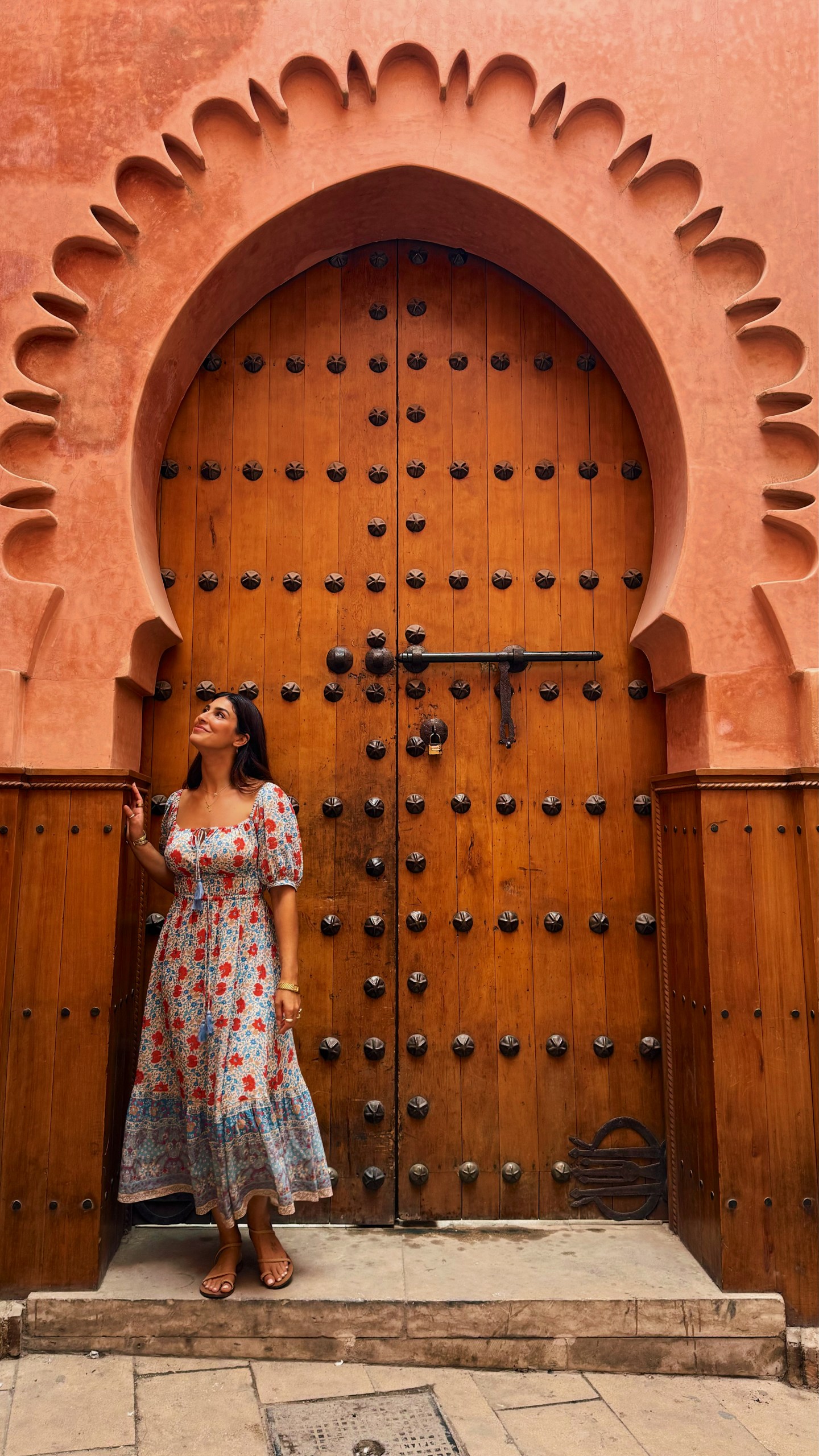 Girl posing at a door archway in Marrakech, Morocco