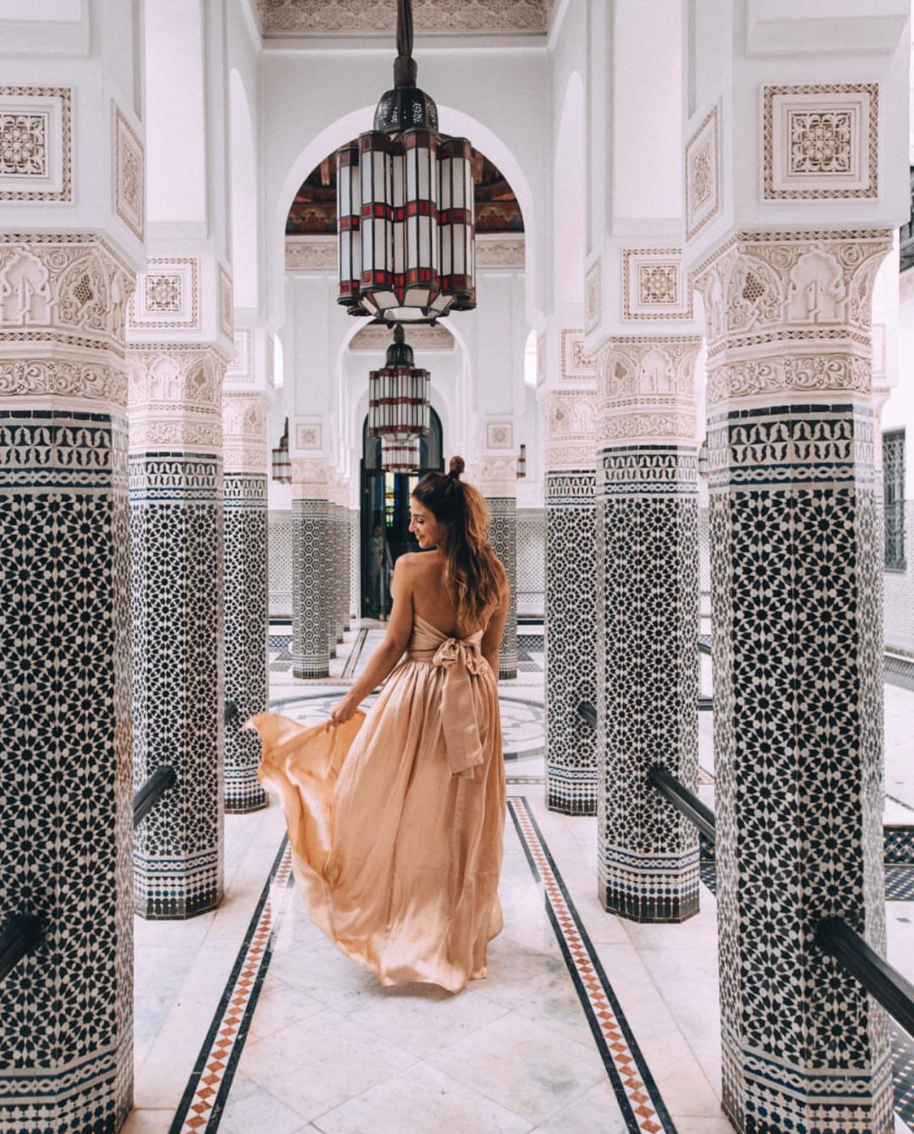 Girl wandering the hallways in the famous La Mamounia hotel in Marrakech, Morocco