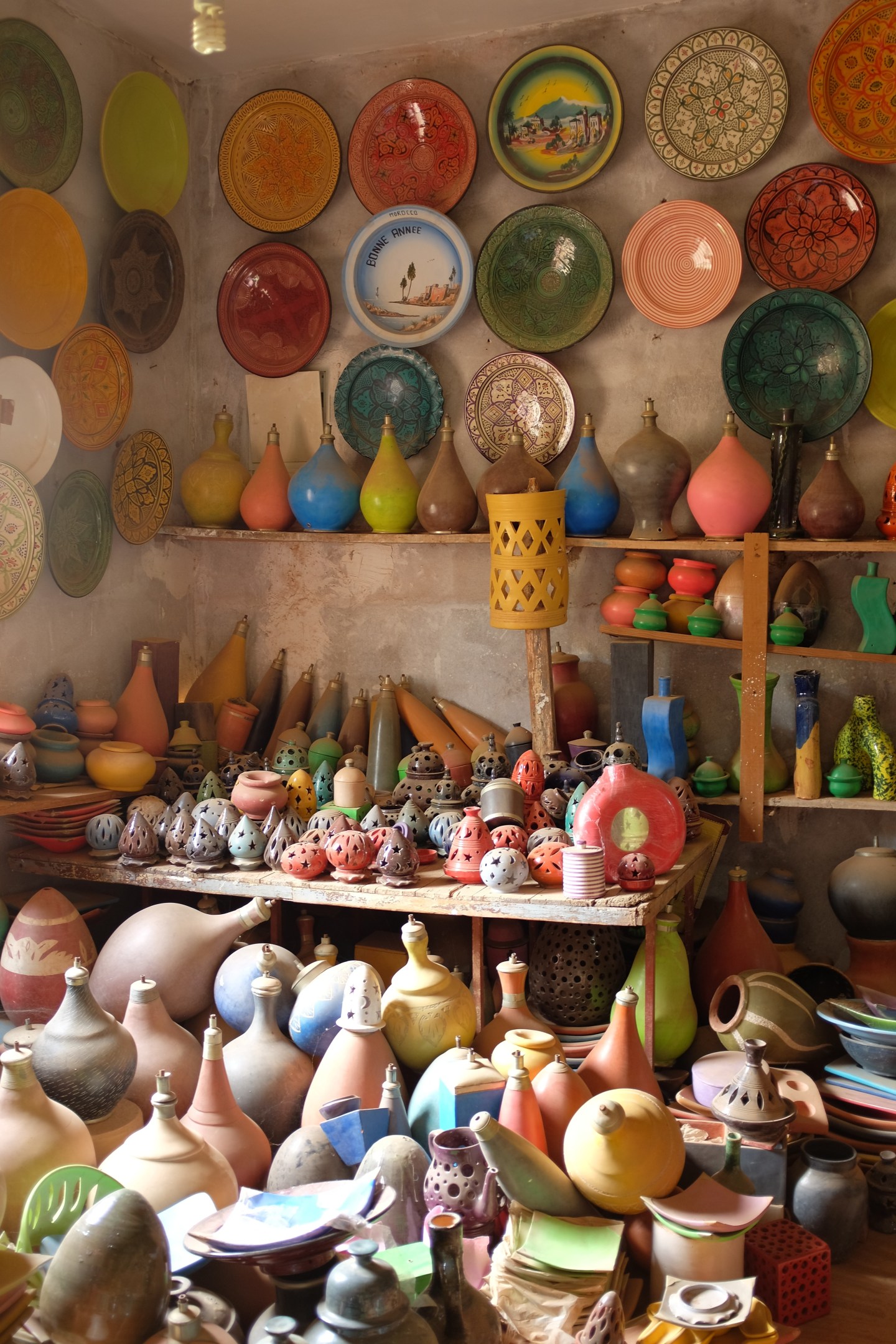 Inside a local pottery vendors shop. Everything is so colourful
